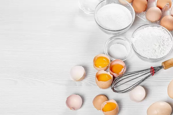 Wooden white table with ingredients for making biscuit (Flip 2019)