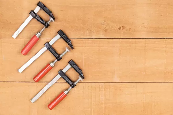 Woodworking F Clamps on the wooden table