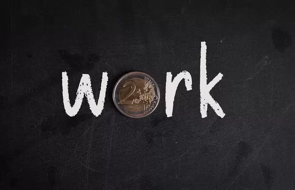 Work text with 2 Euro coin