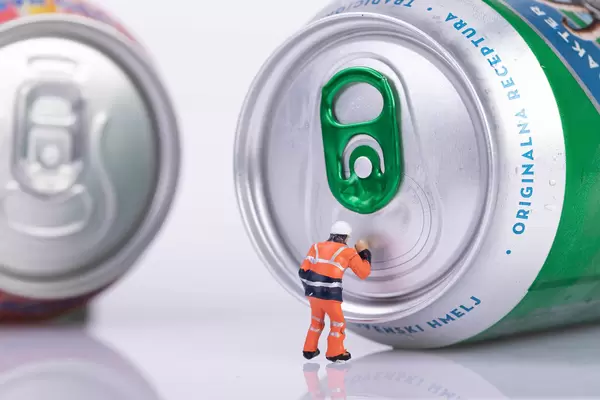 Worker trying to open beer can