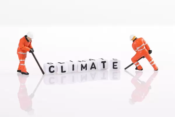 Workers figures with Climate text