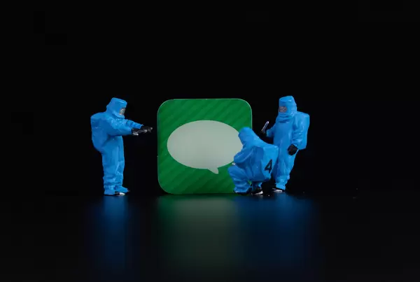 Workers in protective clothes with message app symbol