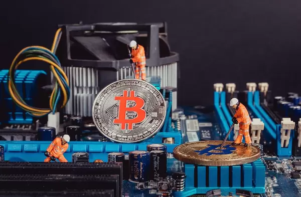 Workers mining Bitcoins