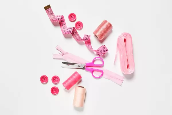 Workplace of a modern tailor with sewing accessories on the table