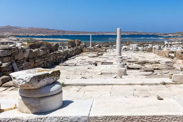World Heritage Site: the ruins of Delos with view of the Aegean Sea and uninhabited island Rineia