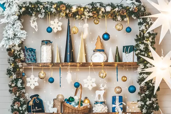 Xmas background decorated shelves with gifts, toy, marshmallow and glowing garland