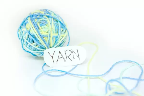 Yarn ball with paper reading YARN