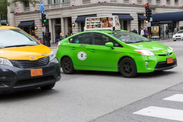 Yellow and green taxis on the streets of Chicago, Illinois