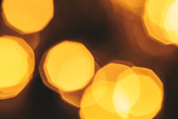 Yellow bokeh of blurred glowing garland