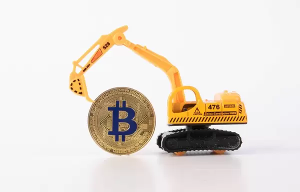 Yellow digger with golden Bitcoin