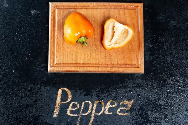 Yellow fresh pepper with water drops