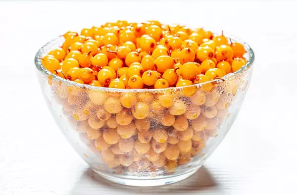 Yellow fresh sea buckthorn berries in glass bowl (Flip 2019)