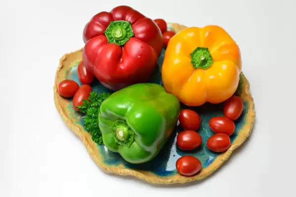 Yellow peppers, red peppers, green peppers and cherry tomatoes