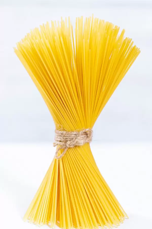 Yellow raw spaghetti