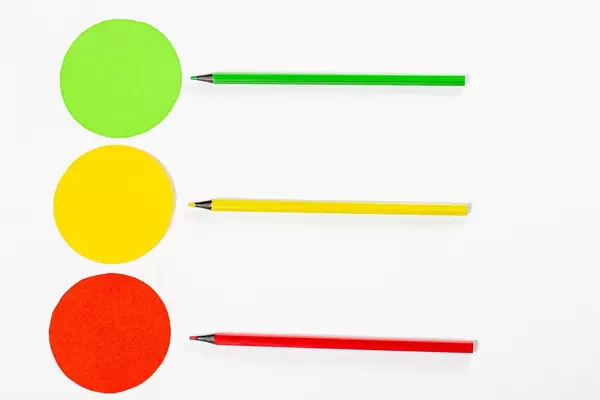 Yellow, red and green circle with colored pencils on white background (Flip 2019)
