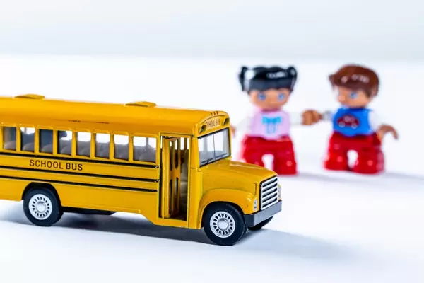 Yellow school bus toy and kids