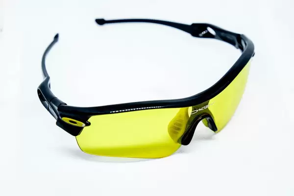 Yellow sunglasses on white background