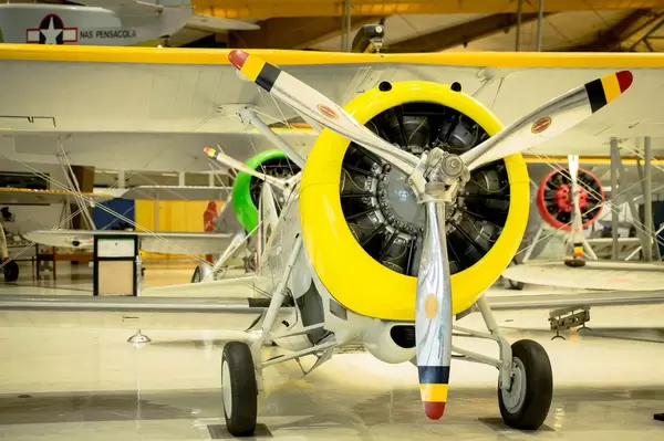 Yellow three propeller plane