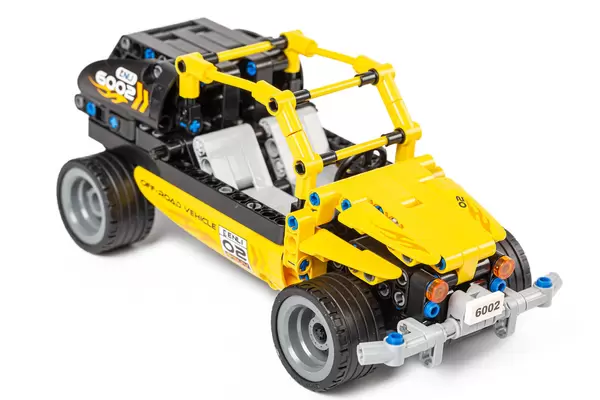 Yellow toy jeep made from a constructor