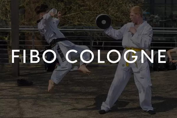 Young martial artists training on an outdoor area, with the picture title "Fibo Cologne"