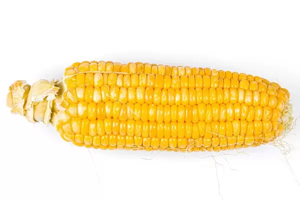 Young sweetcorn on a white background, top view (Flip 2020)