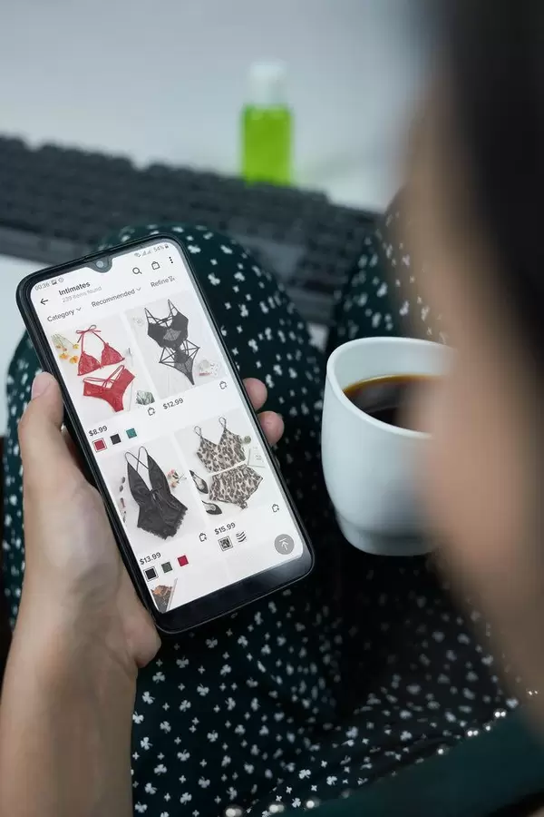 Young woman choosing intimate apparel in women's online shop application