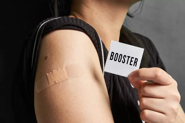 Young woman received a booster dose of Covid-19 vaccine