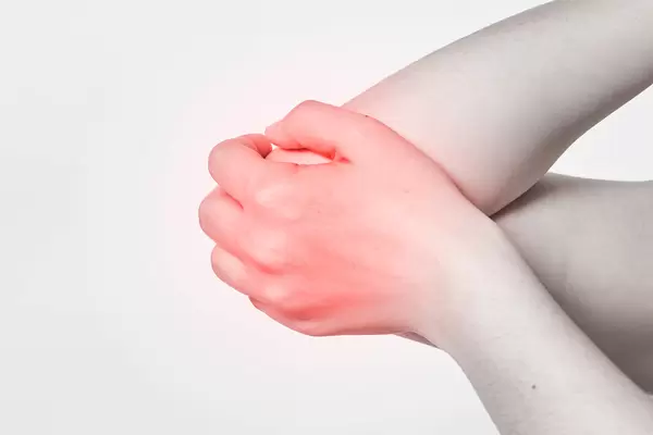 young woman suffering from painful elbow
