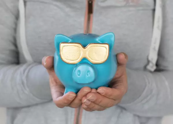 Young woman with piggy bank