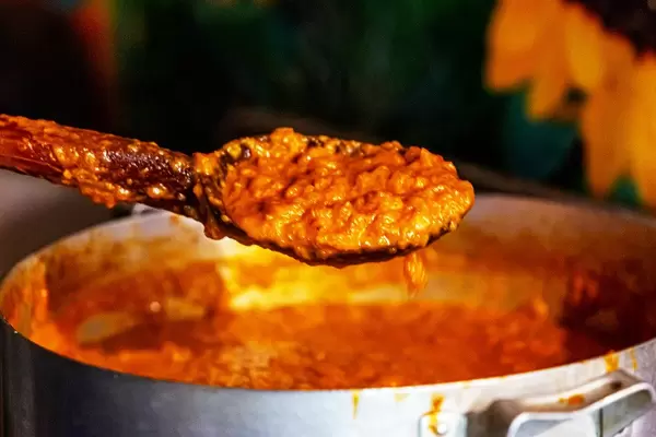 Zucchini caviar in big wooden spoon. Ukraine rustic cuisine