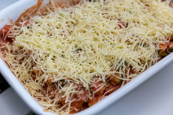 Zucchini, tomato sauce and grated cheese