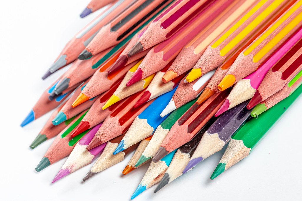Set of colored pencils of different shades of yellow, red and brown