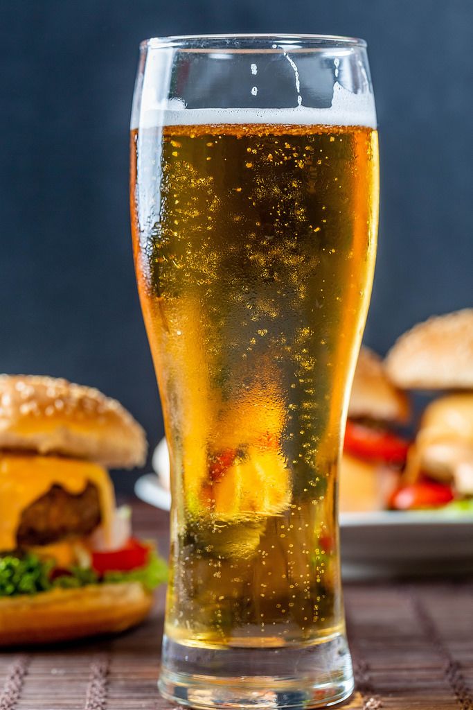 A glass of cold beer and burgers