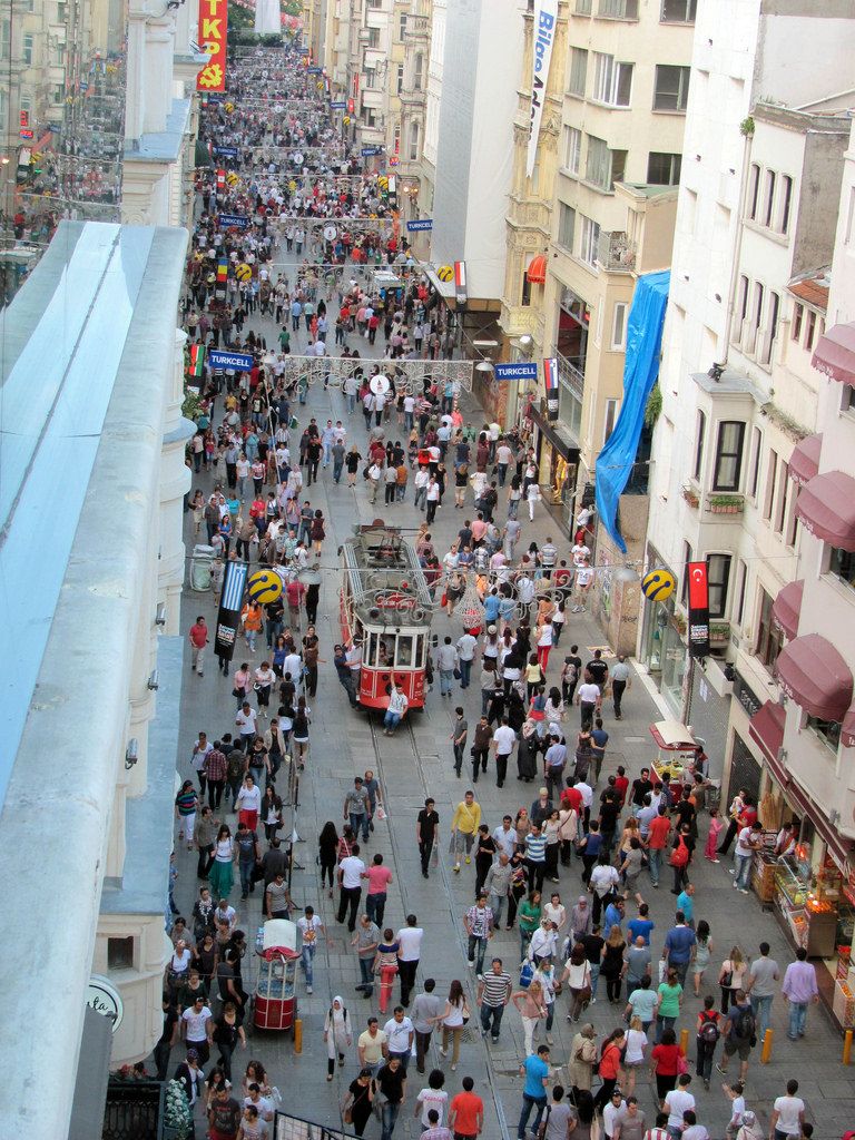 A tram, going along a busy street in Taxim, Istanbul