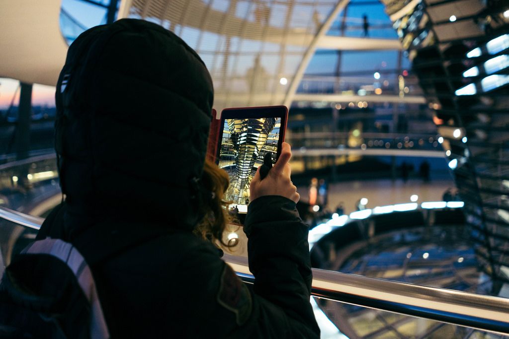 A woman taking picture inside Reichstag Dome