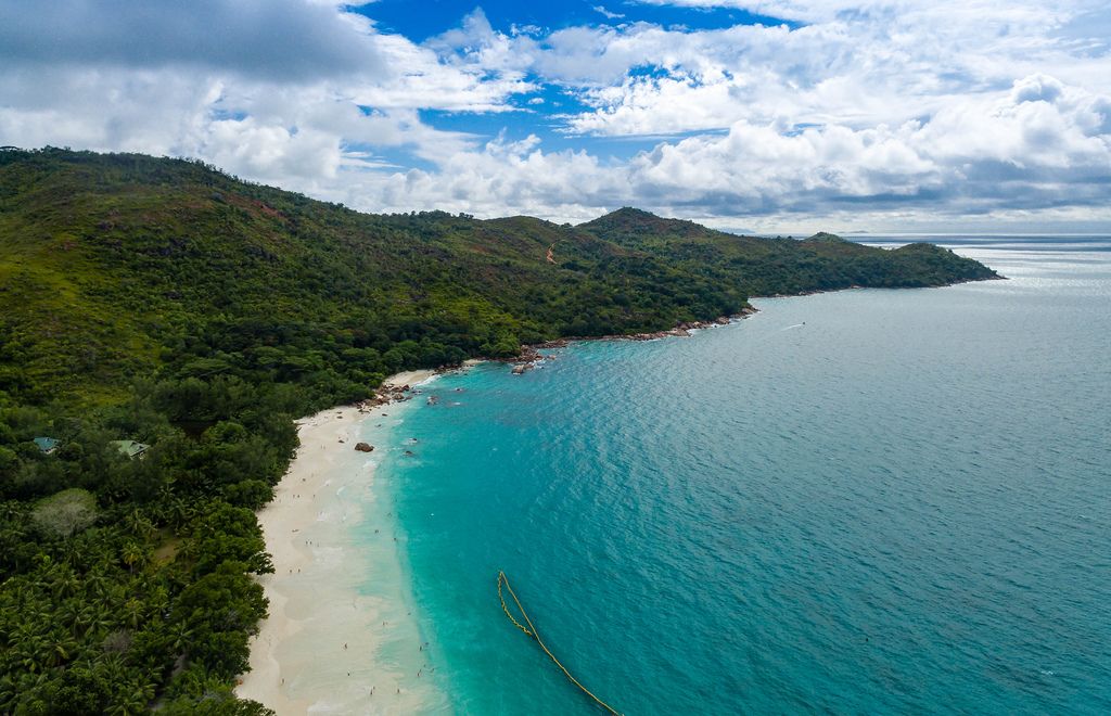 Aerial photo of a breathtaking beach in Grand'Anse Praslin, Seychelles