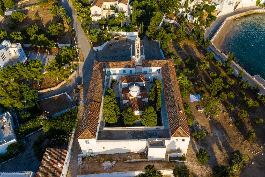 Aerial picture of the mediterranean church and former monastery Agios Nikolaos at the shore of Spetses, Greece