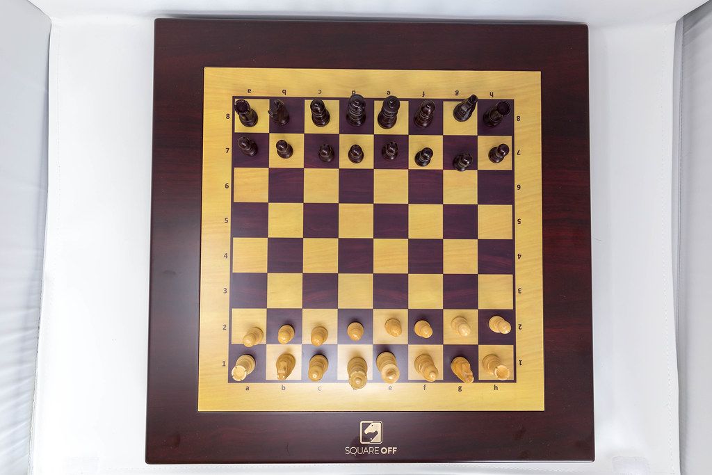 Aerial view of chessboard Square Off - automated chess computer, connected via app to chess players around the world