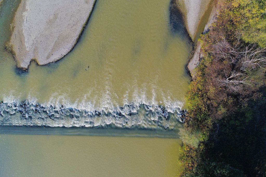 Aerial view of land and water, Arges river in Romania (Flip 2019)