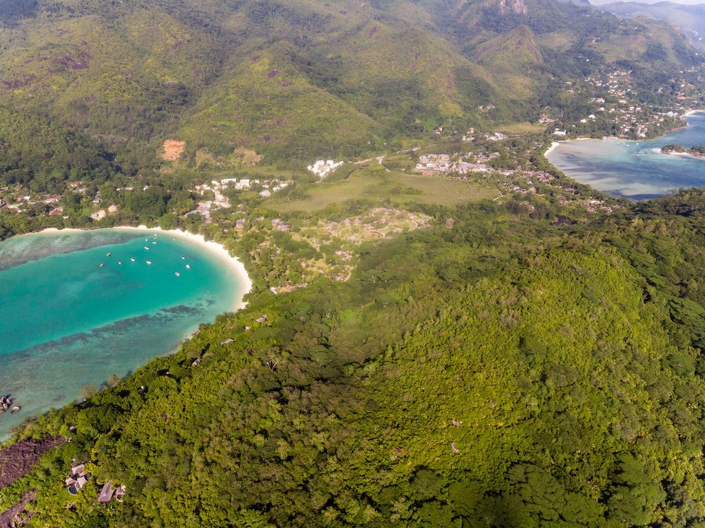 Aerial view of Mahé with the Constance Ephelia Resort Hotel and mangrove forest of Morne Seychelles National Park