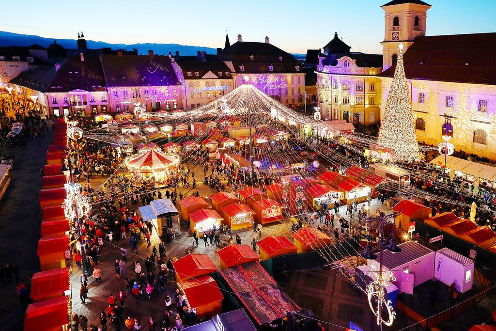 Aerial view of Sibiu Christmas market with Christmas tree and Carousel