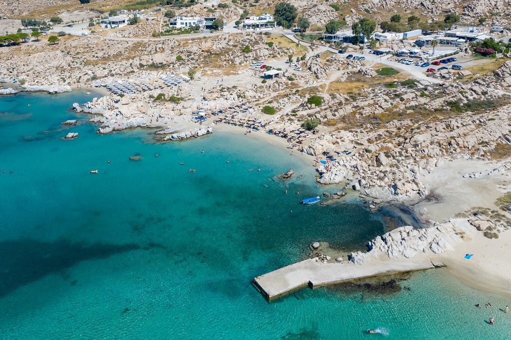 Aerial view shows the rocky coast of granite stones, at Kolimbithres beach, touristic sight on Paros, Greece