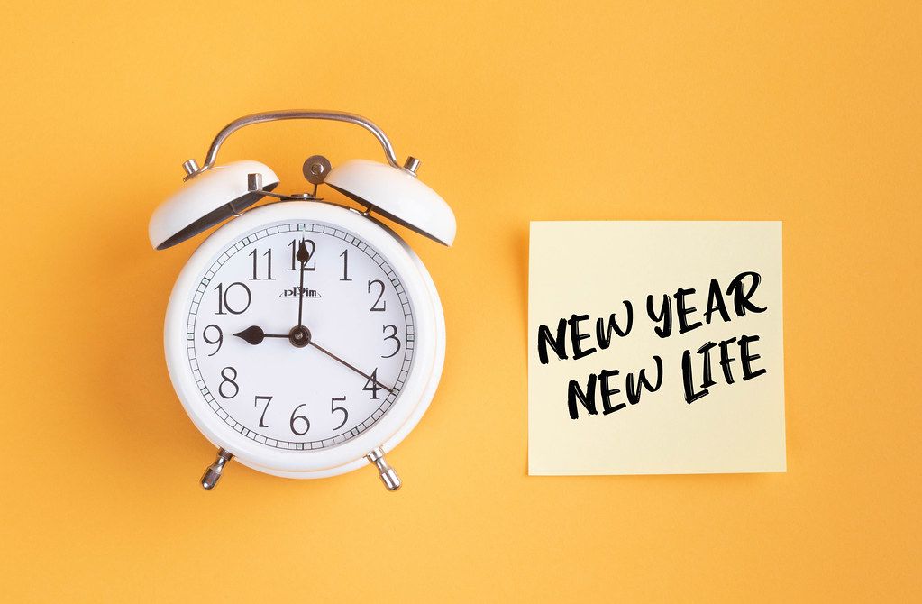 Alarm clock with handwritten text New Year New Life