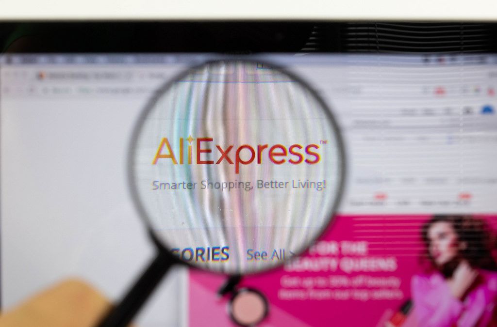 AliExpress logo on a computer screen with a magnifying glass