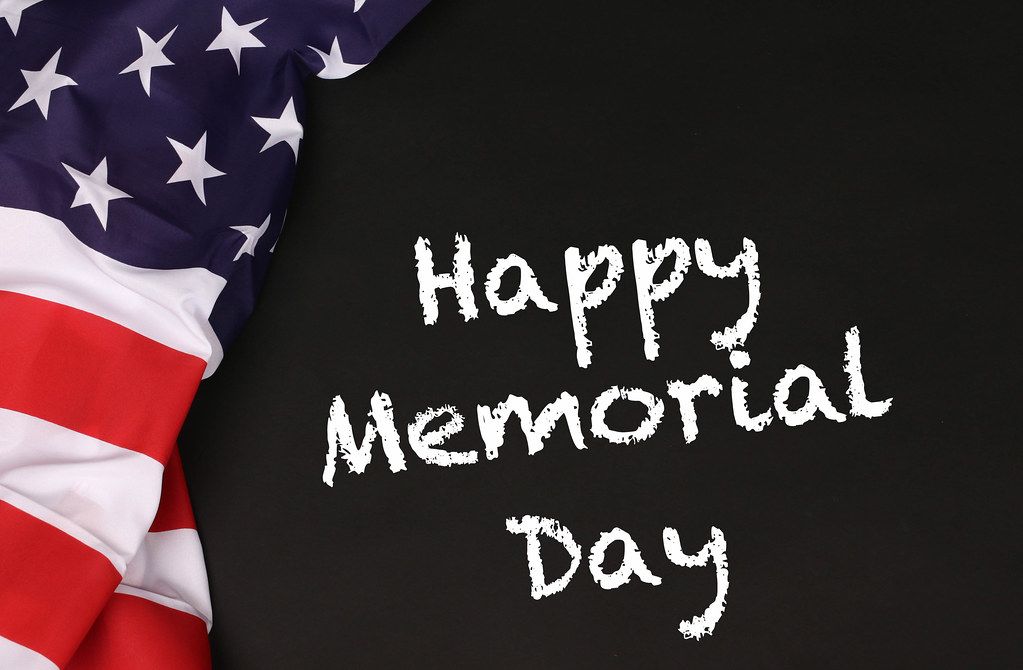 American flag with the text Happy Memorial Day against a blackboard background