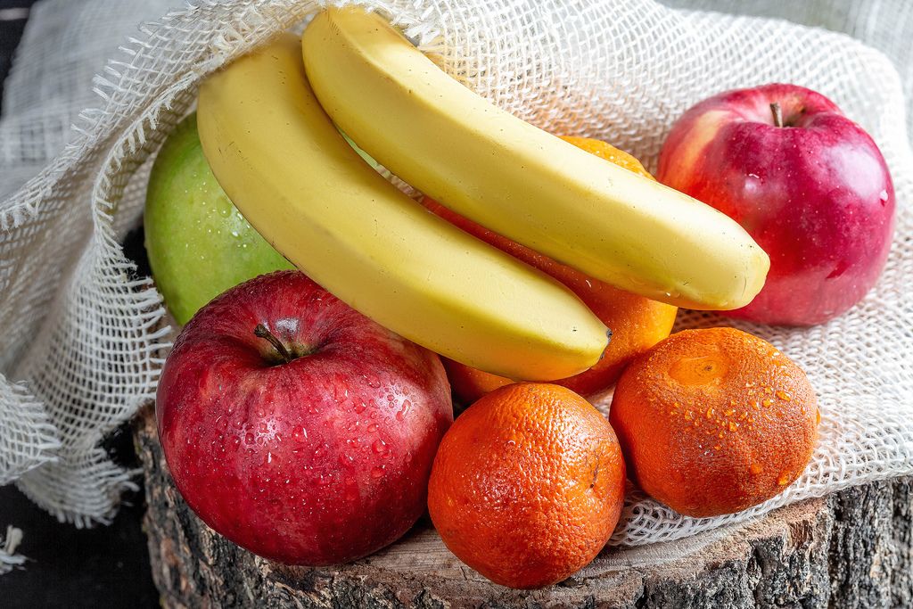 Apples, bananas, tangerines and oranges on burlap (Flip 2019)