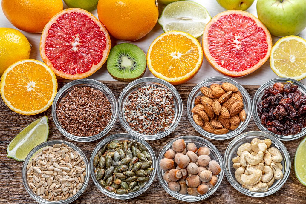 Assortment of colorful fresh fruits, nuts and seeds. Top view (Flip 2019)