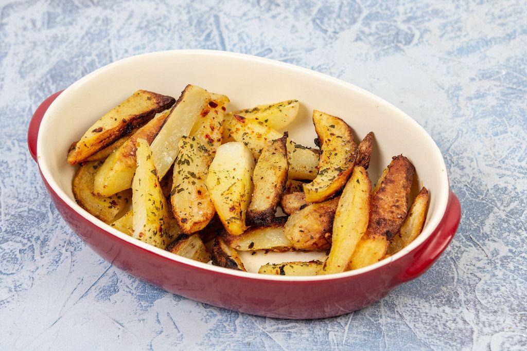 Baked Potatoes served in the bowl on the table (Flip 2019)