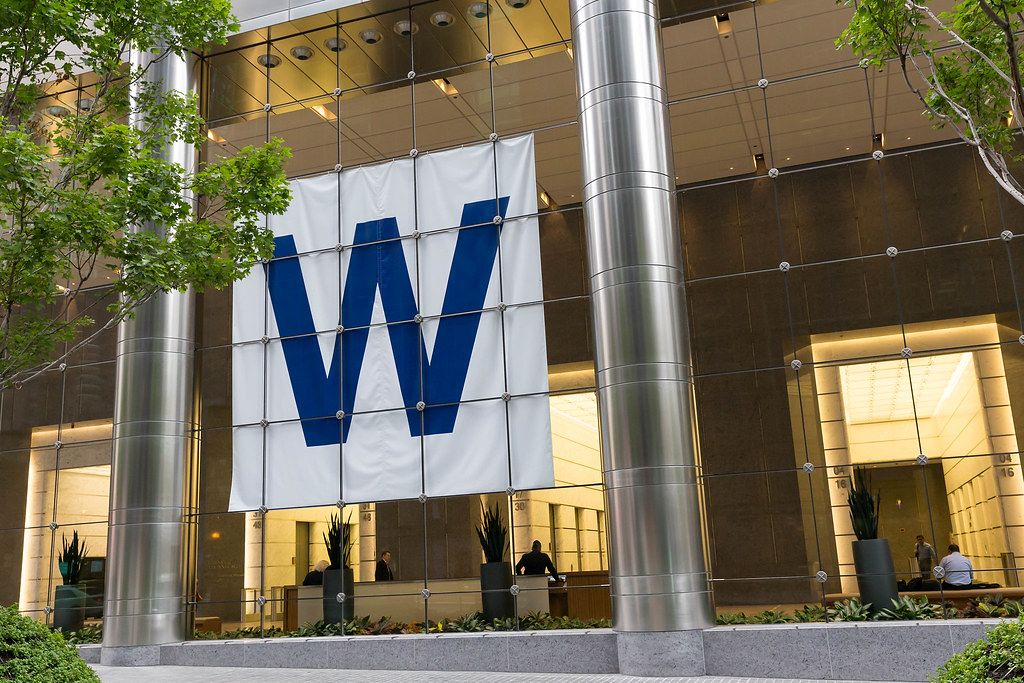 Big W letter behind a glass front of an office building (Winning Flag. #FlyTheW)