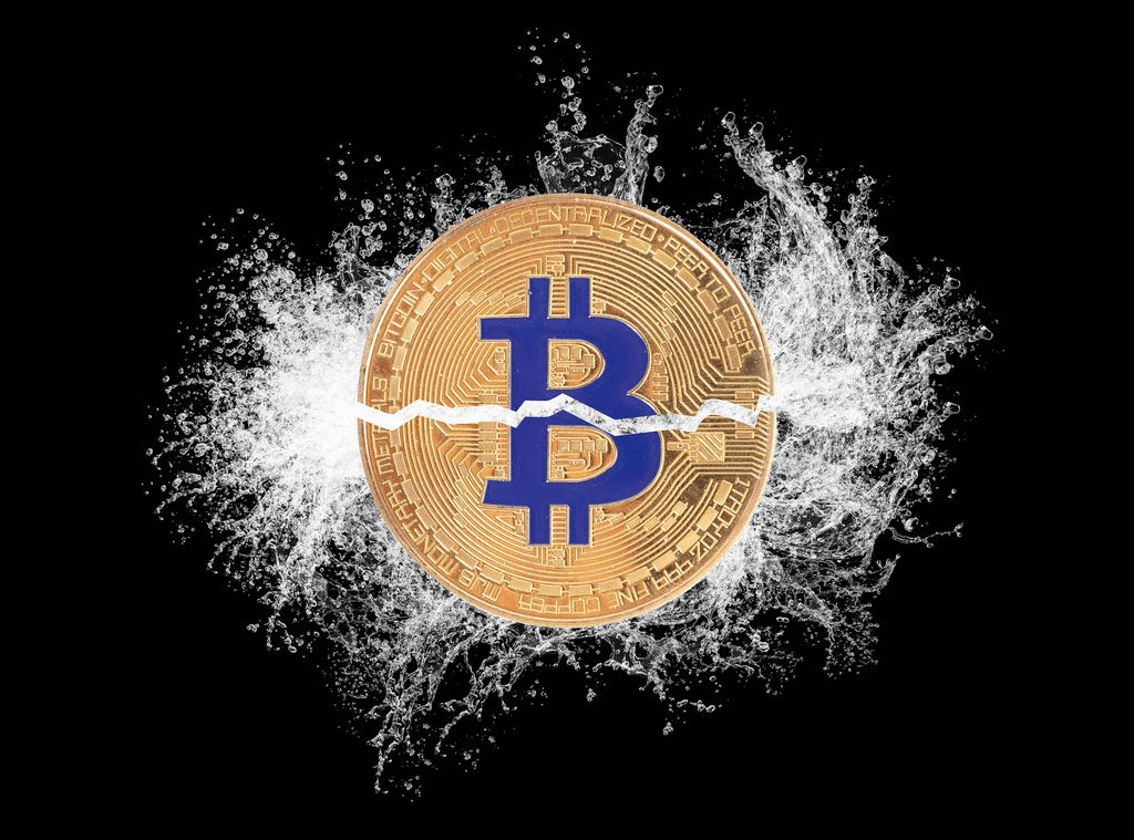 Bitcoin broken in half with water splash